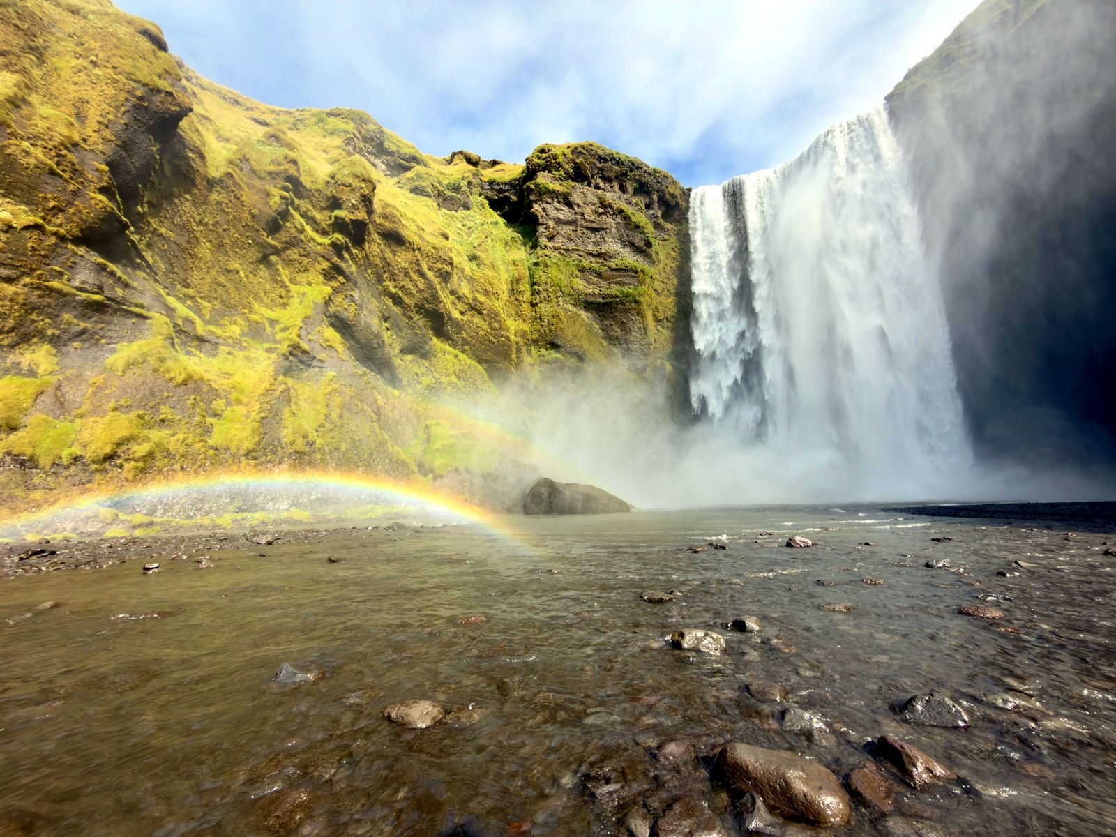 A double rainbow in the spray at the base of Skógafoss